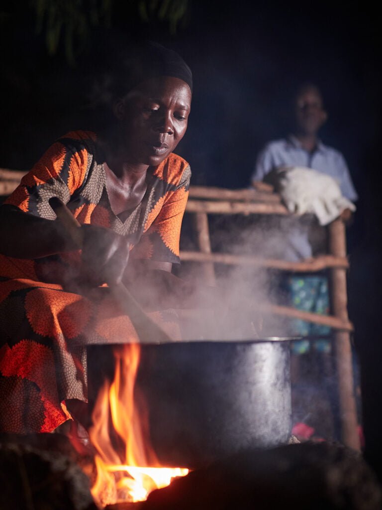 Ugandan Woman cooking dinner in orphanage